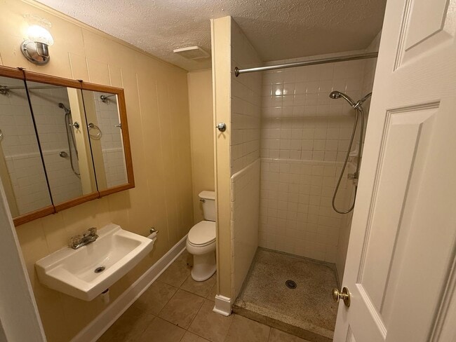 Building Photo - Updated 4BR Home with Finished Basement & Level Yard