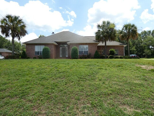 Primary Photo - Spacious 4-Bedroom Pool Home