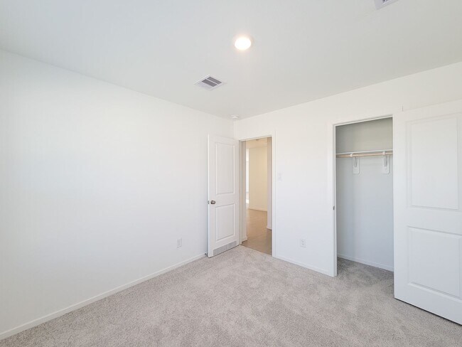 Building Photo - This single-level home showcases a spacious open floorplan shared between the kitchen, dining are...