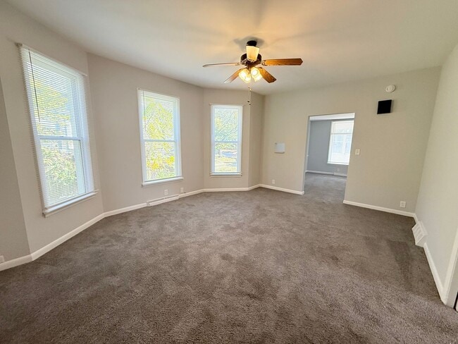 Building Photo - Spacious 4-Bedroom Home with Fenced Backyard