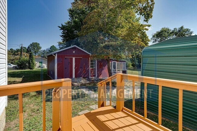 Building Photo - Updated house with carport and shed on corner lot!