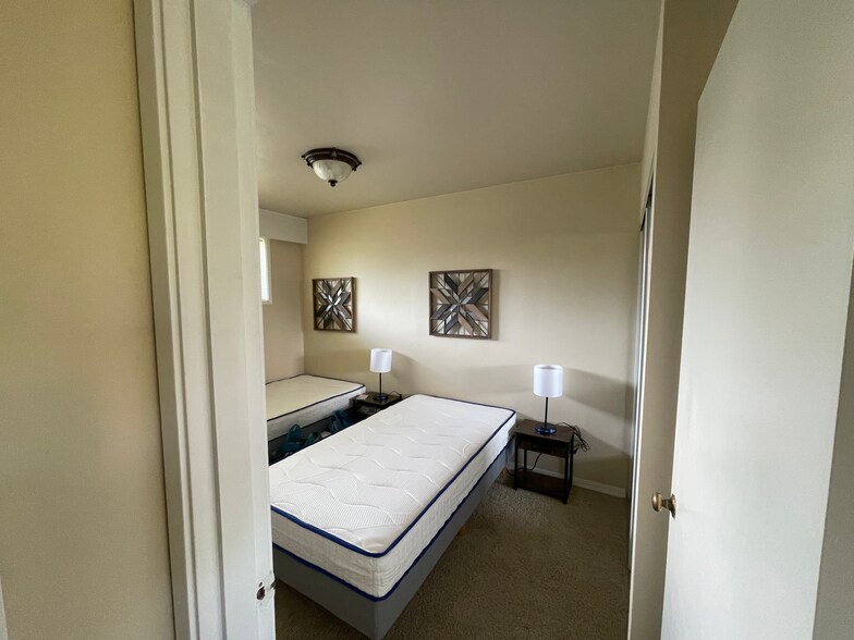 Each bedroom includes a closet and full built-in cabinet with drawer system behind door - 2172 W 15th Ct
