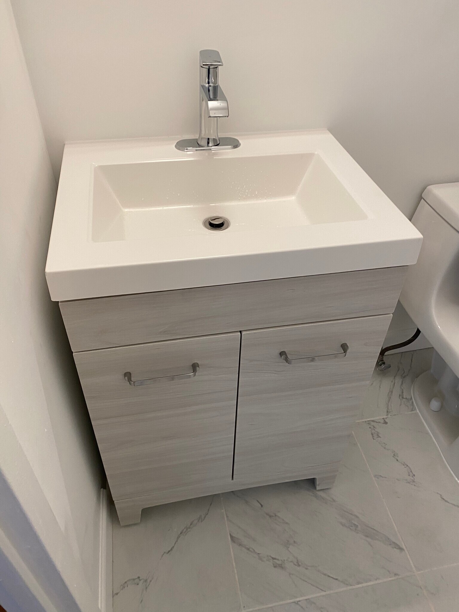 Bathroom sink and cabinet - 45 river drive south