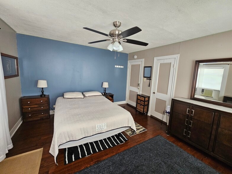 Queen bed with dresser and closet. - 2506 Elmen St
