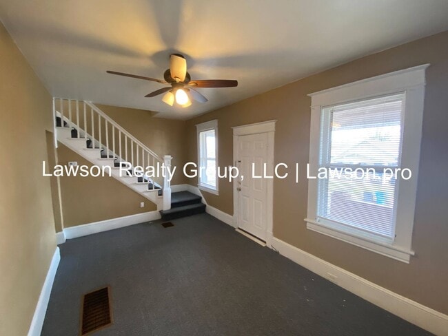 Building Photo - Updated Three Bedroom with Flat Yard