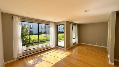 Building Photo - Walk to the Water from your Patio in this ...