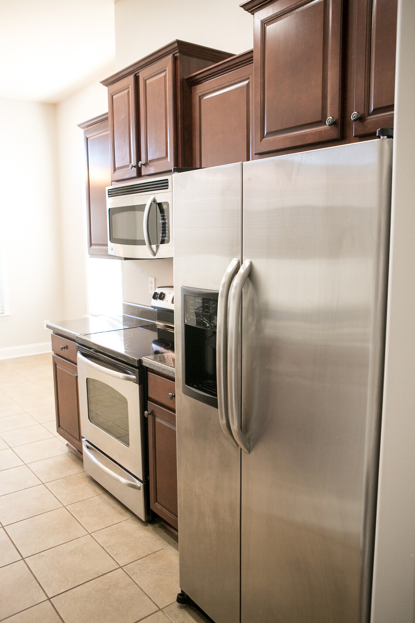 kitchen with stainless appliances, eat in dining in background - 307 Dovington Dr