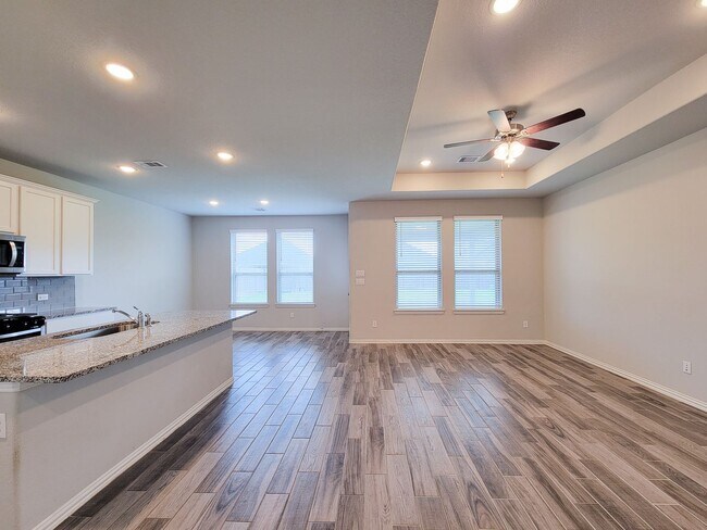 Building Photo - Quiet Cul De Sac! Tray Ceiling in Family & Primary suite. Wood Like Tile, Modern Gray Walls, Grea...