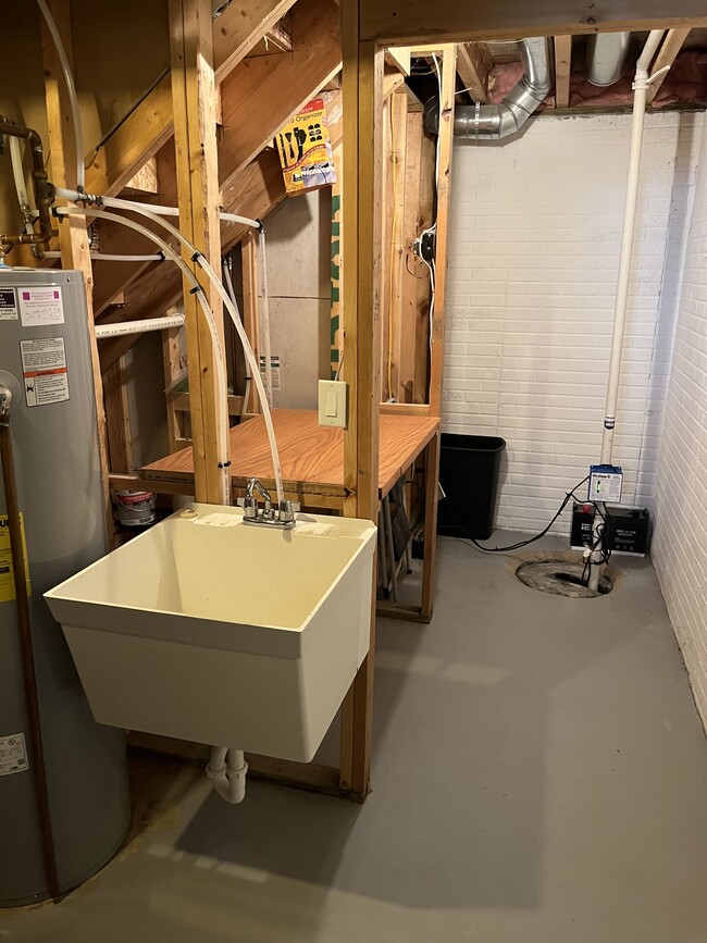 Tub sink and storage area in lower level - 2804 Porter Ridge Rd