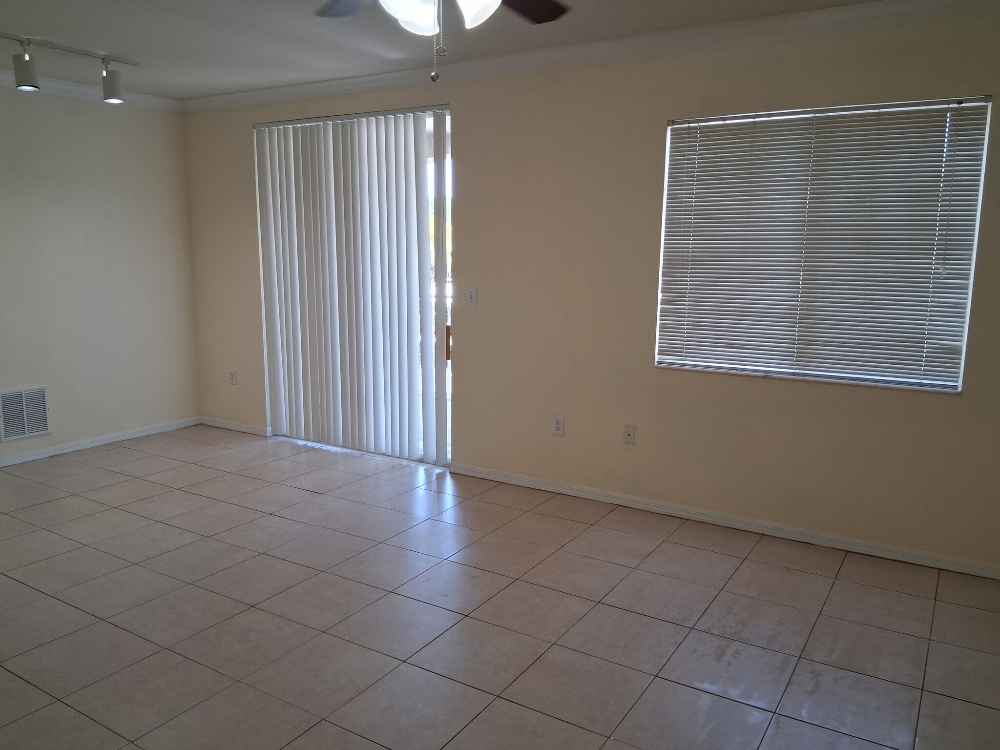 Living dining great room opens to balcony - 6482 Emerald Dunes Dr