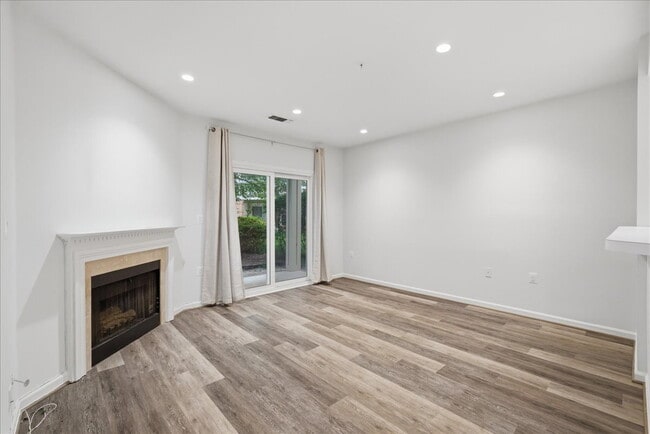 Building Photo - Commuter’s Paradise! Ground-Level 2BR Condo  Welcome home to this stunning, sun-filled 2-bedroom ...