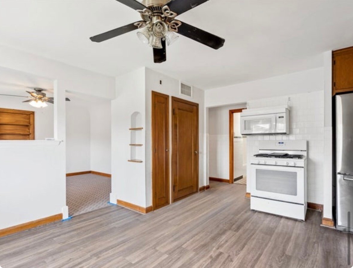 Kitchen with a small view of living room - 1614 S 58th St