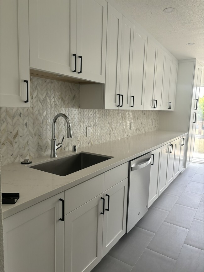 Kitchen with extended cabinets - 301 Tradewinds Dr