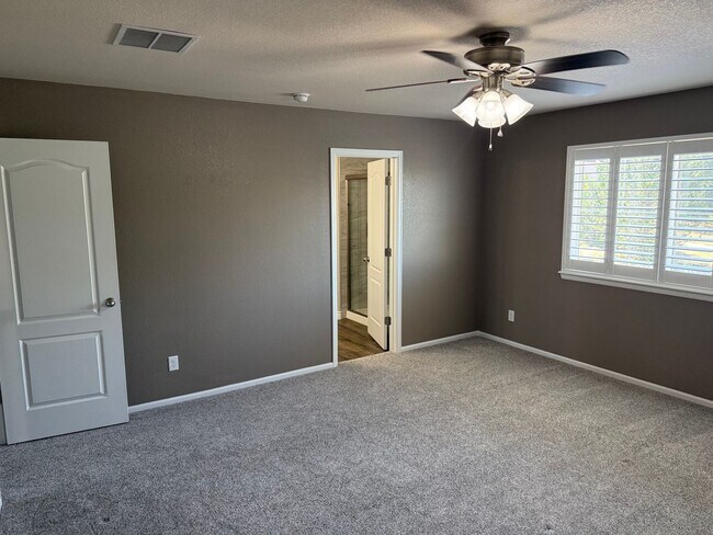 Building Photo - Greenbelt-Backed Wheatlands Home - Mountain Views, 3 Car Garage & Finished Basement
