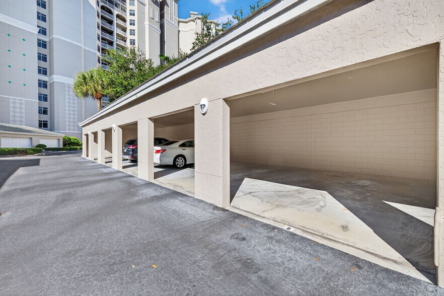 Covered parking—garage/carport hybrid - 1001 Arbor Lake Dr