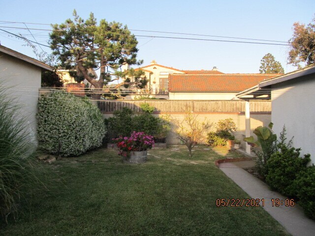 Back yard , gardening area near brick wall - 8124 Gonzaga Ave