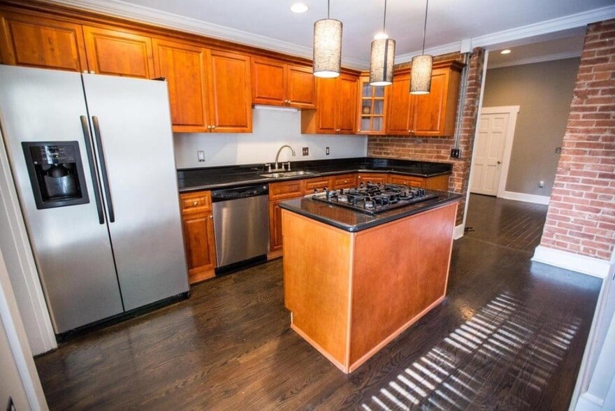 Updated kitchen with lots of storage. Stainless steel appliances. Gas range and dishwasher. - 715 S 5th St