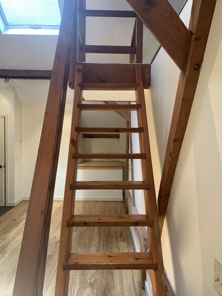 Going up the staircase to the loft - 7098 FERRY Rd