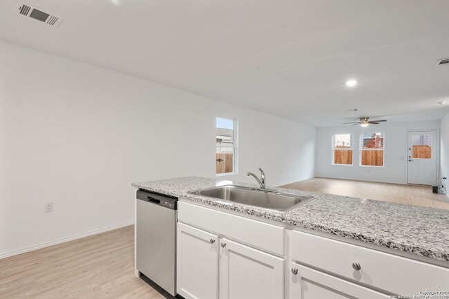 Building Photo - This beautiful single-story home has 4 bedrooms, 2 baths, vinyl flooring throughout, an open floo...