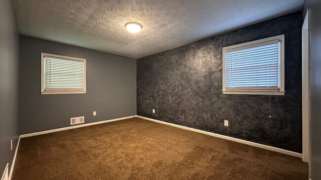 Building Photo - Spacious 4-Bedroom, 3-Bath Home with Moder...