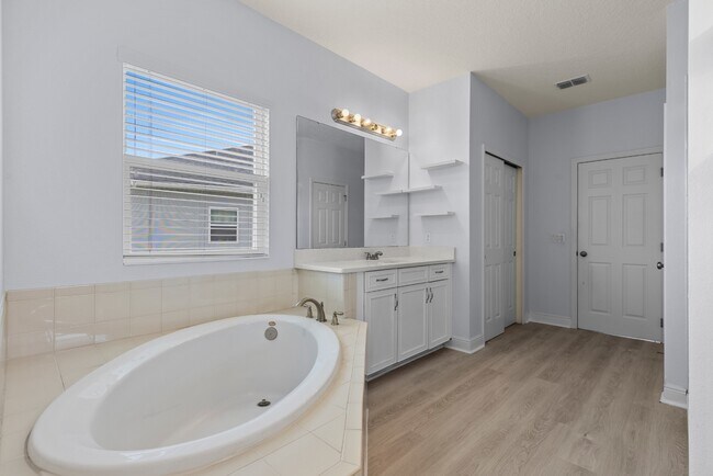 Building Photo - Spacious 6-Bedroom Home Near Lake Nona | 3-Car Garage + Tesla Charger