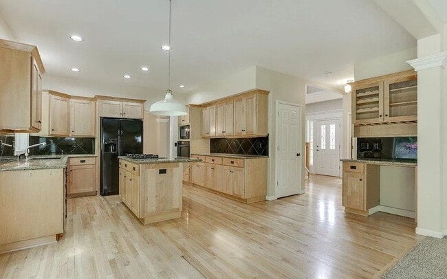 Building Photo - Spacious Four-Bedroom Home with Gourmet Kitchen, Multiple Living Areas, Loft, and Beautifully Lan...