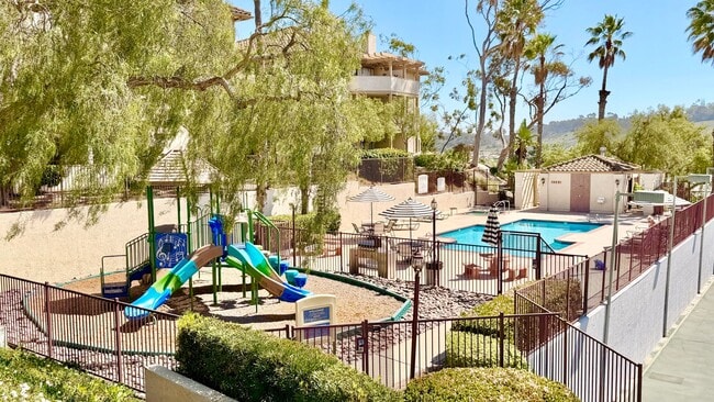 Building Photo - Beautifully Remodeled and Updated Upstairs Condo Unit in the Private & Gated Vista Way Village Co...