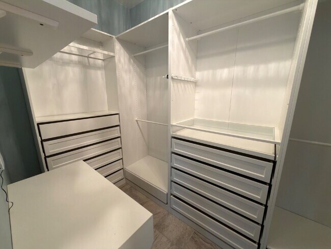 Building Photo - Four bed two bath on a corner lot with a pool in Sunfield. Gas cook top, double ovens. Open kitch...