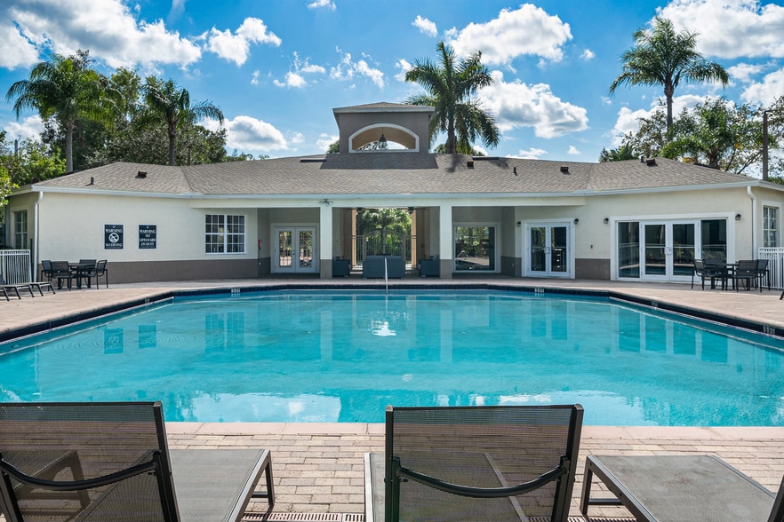 Enjoy a resort-style pool and relax at your pool deck - Pine Lakes Preserve