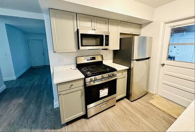 Fully renovated kitchen with new appliances. - 767 SW Ravenswood Ln