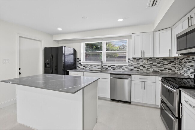 Building Photo - Renovated 3BR/2BA Corner Single-Family Home – Large Fenced Yard, NO HOA