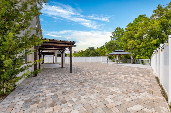 Building Photo - Spacious 6-Bedroom Home Near Lake Nona | 3-Car Garage + Tesla Charger