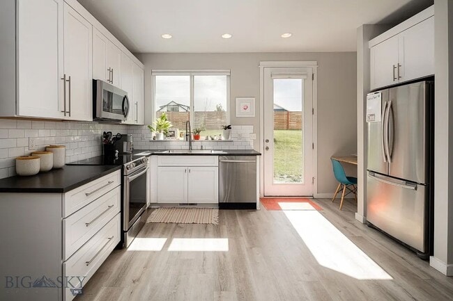 Building Photo - Charming Three Bedroom Home with Large Fenced Yard