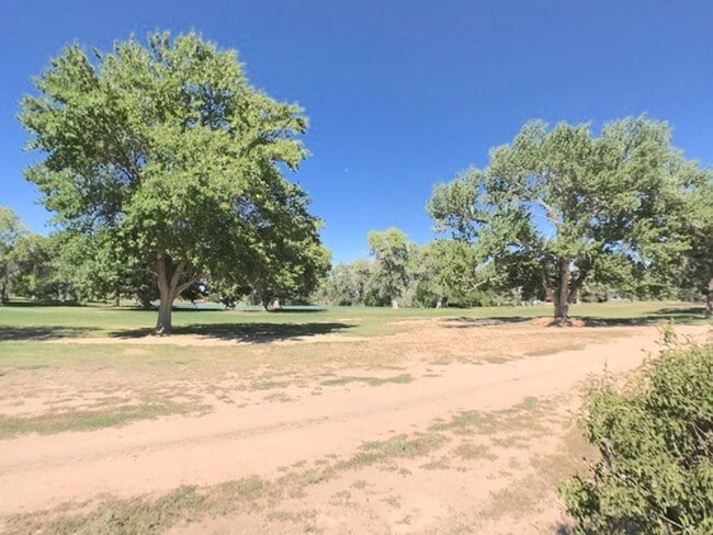 Building Photo - Spacious 2BR/2BA located on Golf Course in Rio Communities. Hardwood floors in living space. 2 Ca...