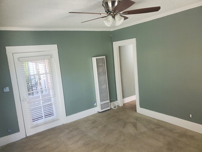 Front room and heater. - 1666 Locust St