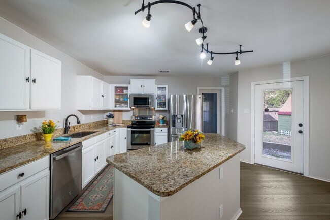 Building Photo - Patio Living with Basketball Court