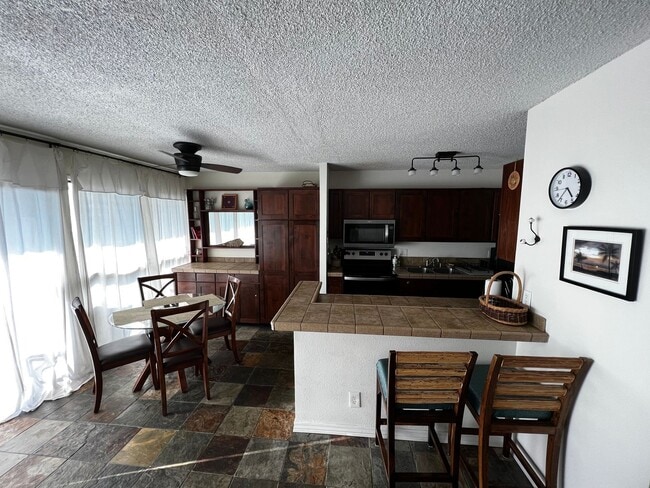 Building Photo - Furnished 2 bedroom 2 bath condo with assigned parking stalls