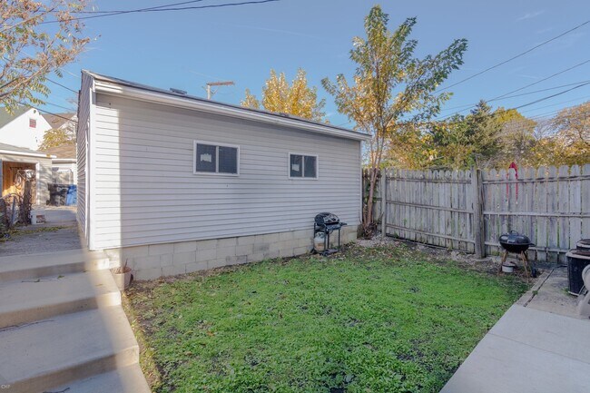 Back yard and garage - 3030 N Elbridge Ave