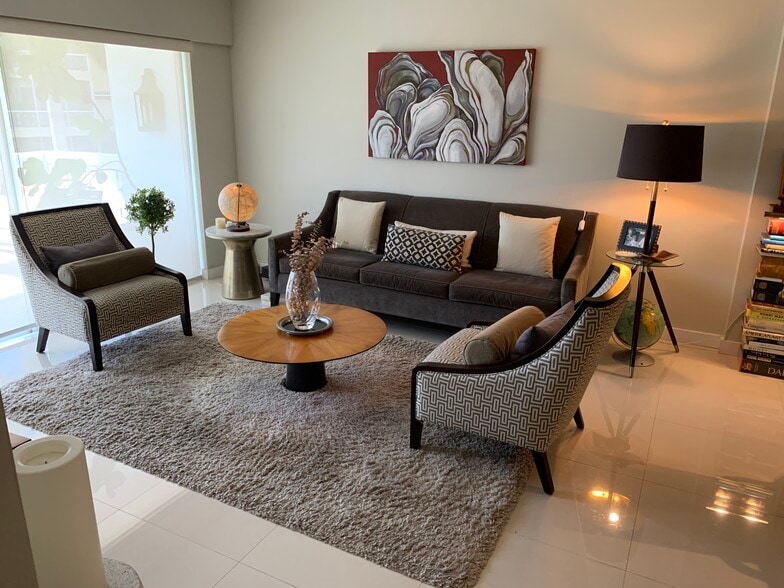 Living room (shown furnished here for scale) - 1100 N Shore Dr NE