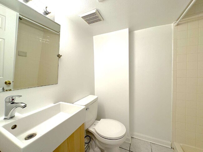 Building Photo - Charming 2BR Townhome with Finished Basement, Fenced Yard & Private Driveway Near Huntington Metro