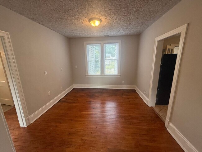 Building Photo - 2-bedroom 1 bathroom Cottage on a large lot with 2 large storage building on site