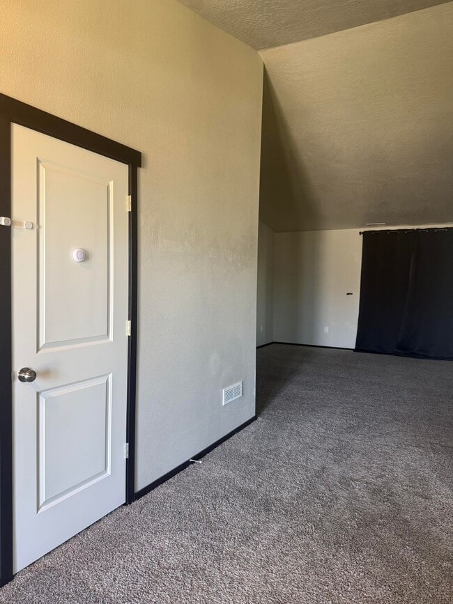 Building Photo - Lots of storage space in this 4- Car garage for all your playthings!!