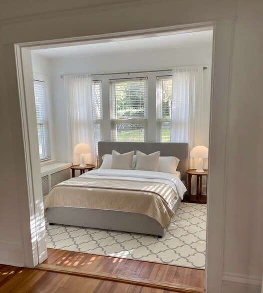 sunny bedrroom surrounded ny windows - 25 Lenox Ave