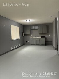 Building Photo - 319 Pontiac-Front