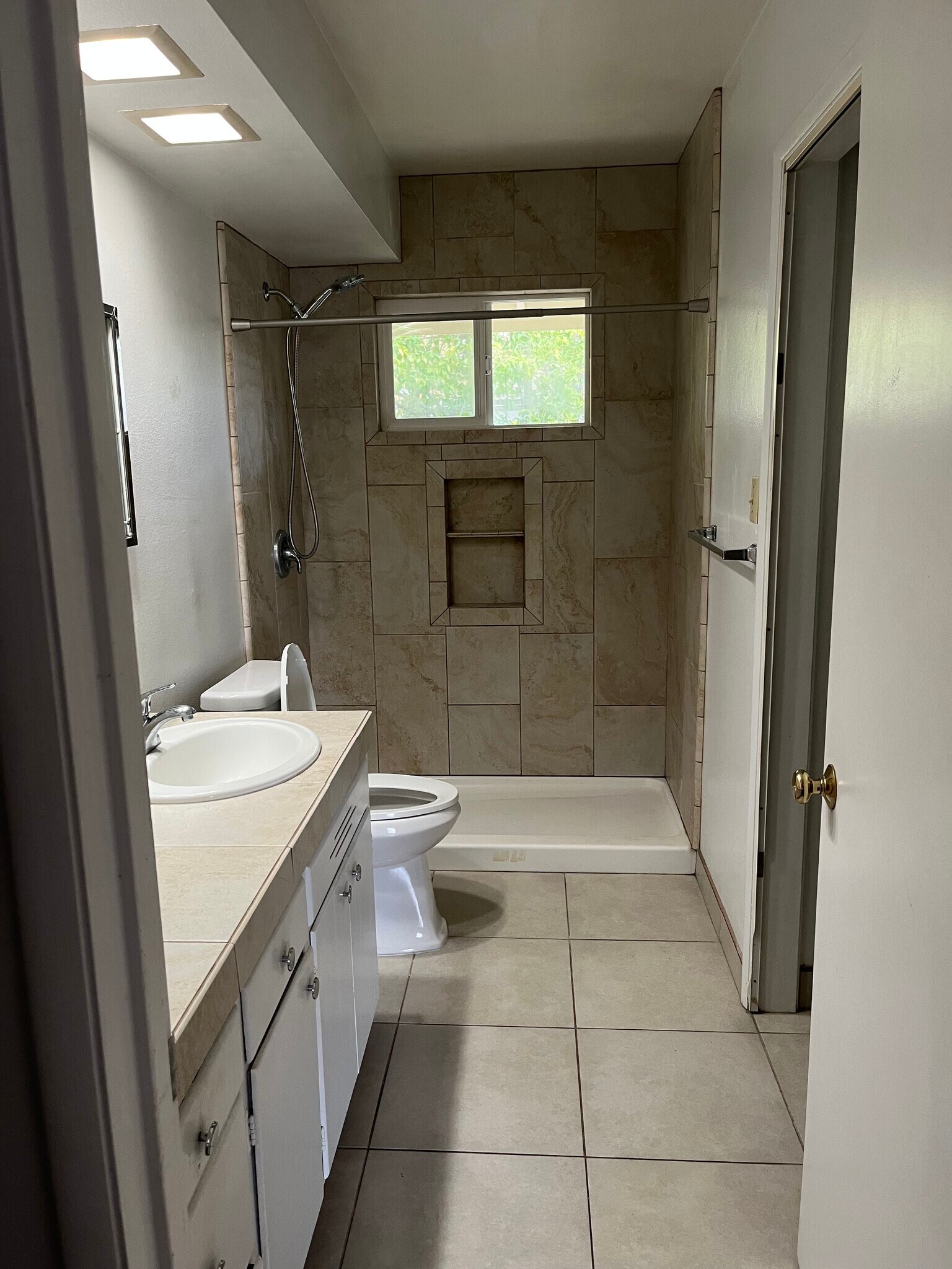 Tiled shower, counter top and floor - 513 28th St