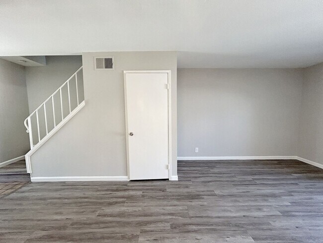 Building Photo - Move-in ready Evergreen townhome with private backyard, detached 2-car garage, and great communit...