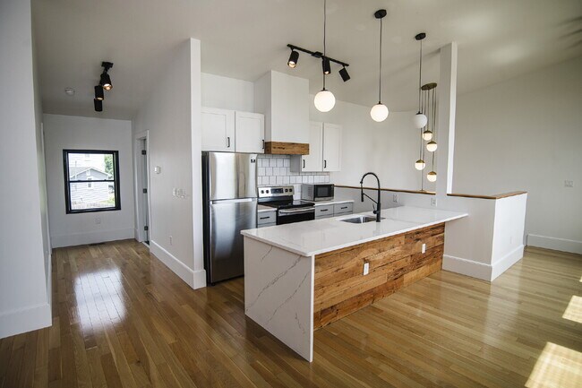 Building Photo - August Only: Submit your application this month and pay a reduced application fee of just $32. Ch...