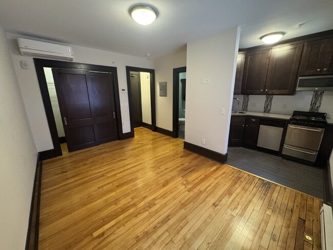 Building Photo - "Charming Studio Retreat with Hardwood Elegance in Downtown Minneapolis!"