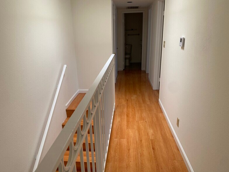 Hallway to Remaining Bedrooms - 308 E Valencia Ave