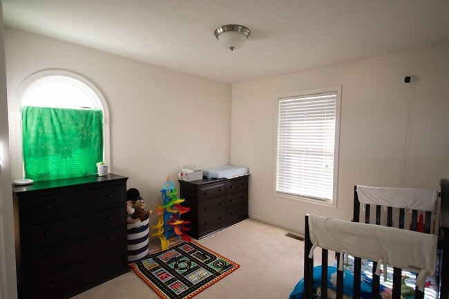 Building Photo - End Unit Townhouse With Garage and Unfinis...